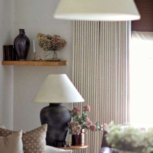 Close-up of the professional memory-shaped drape effect on custom linen pinch pleat curtains