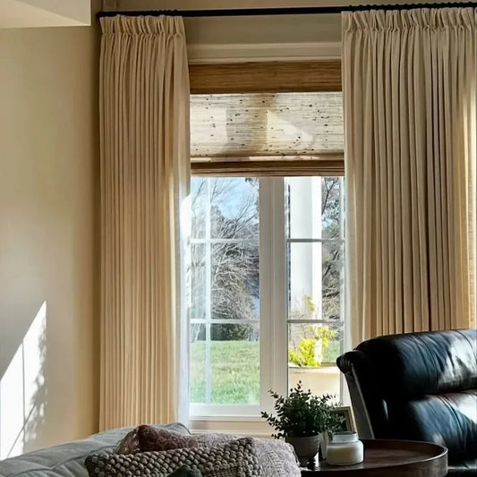 Elegant Light Khaki custom linen drapes featuring a classic hook and ring style in a living room.