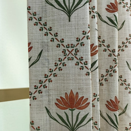 Macro shot of the 10% linen fabric texture and vintage red floral print with natural slub details.