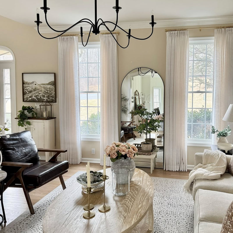 Custom beige and off-white linen curtains styled in a modern living room