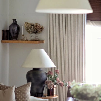 Close-up of the professional memory-shaped drape effect on custom linen pinch pleat curtains