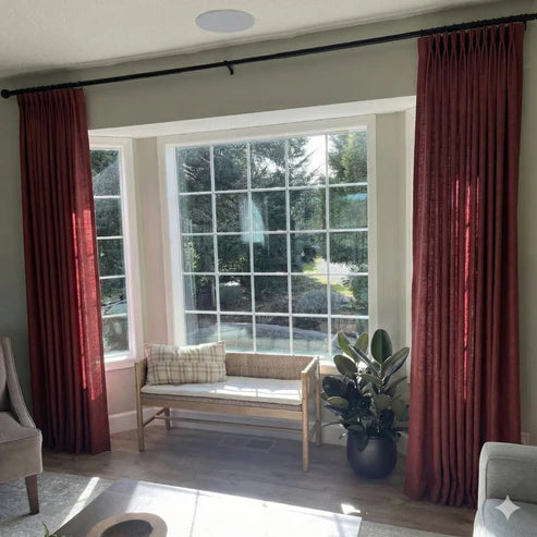 Vibrant Cinnabar pinch pleat linen curtains with handcrafted folds