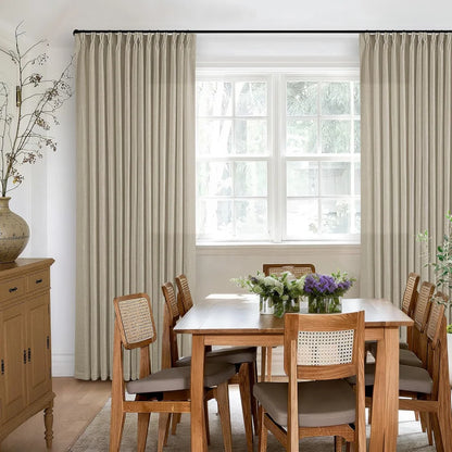 Side view of premium Light Khaki linen drapery showing the elegant hanging effect in a dining room.