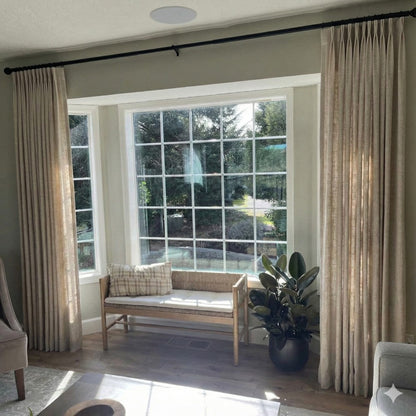 Sophisticated Tapioca pinch pleat linen curtains with tailored folds