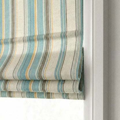 Side profile of the classic flat fold stacking mechanism on a striped linen-blend roman shade.