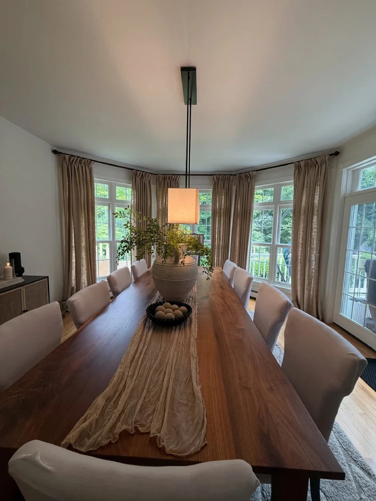 Main view of Light Khaki linen curtains with hooks and rings in a spacious dining room.