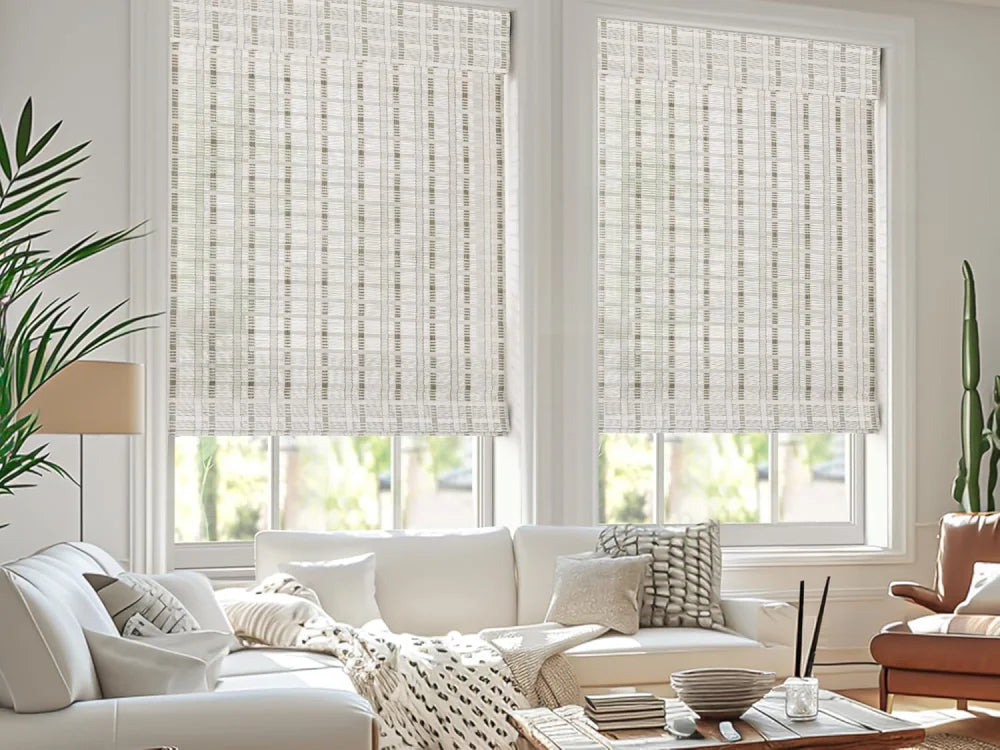Matching white bamboo shades for multiple windows in living room.