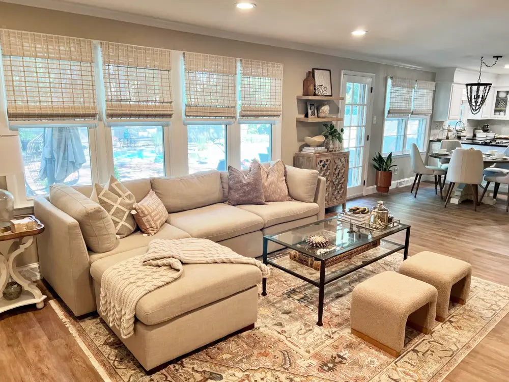 Soft light filtering effect through white indoor bamboo shades.