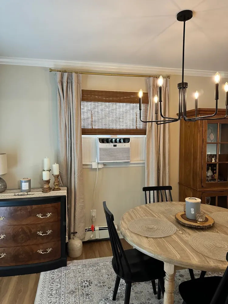 Bamboo roman shades in brown, installed in dining room window for light filtering and elegant decor