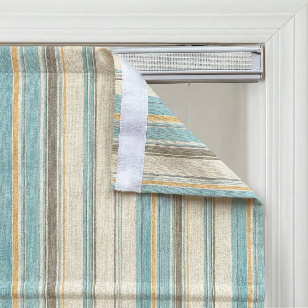 Close-up of custom striped linen roman shade in sage green and light blue, showing the vertical stripe pattern.
